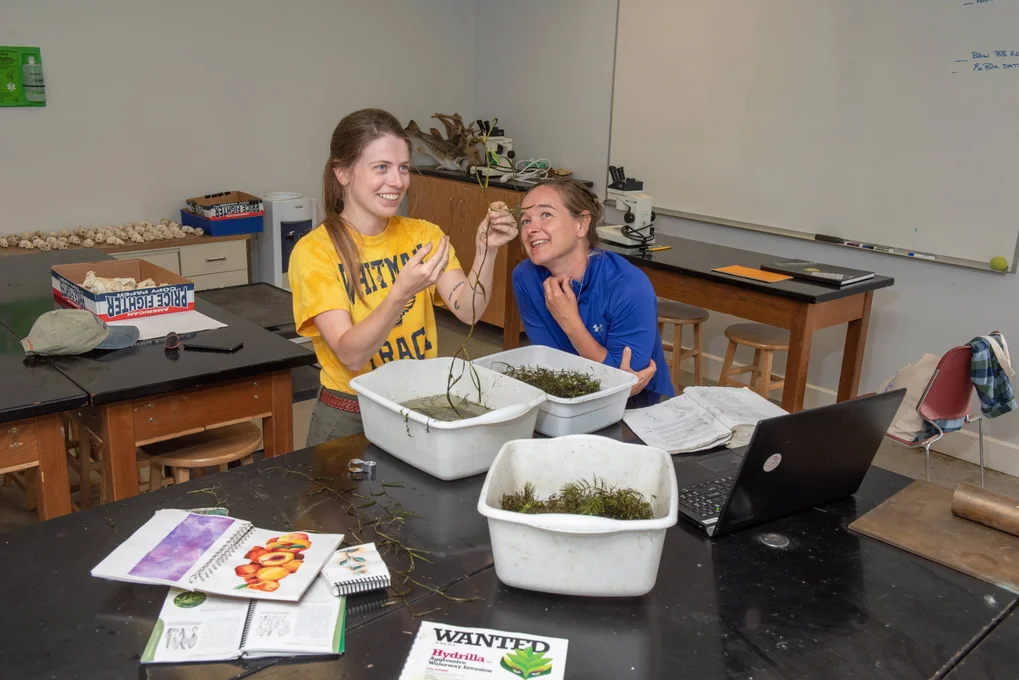 Two FLCC students examine native plant life together at Muller Field Station.