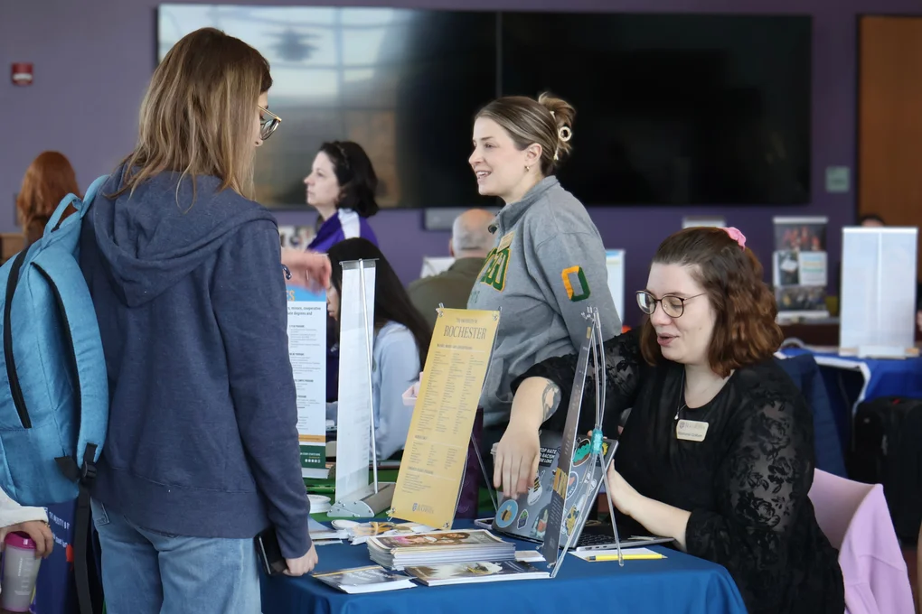 A student discussing transfer options with a representative from a four-year university.