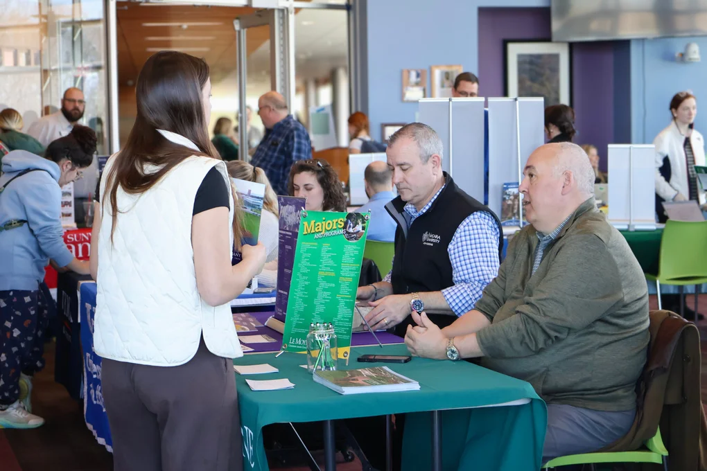 A student discussing transfer options with a representative from a four-year university.