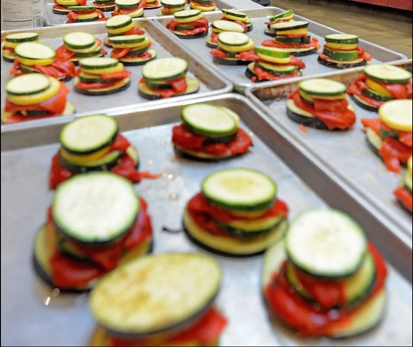 Sheet ban with stacked vegetables ready to cook