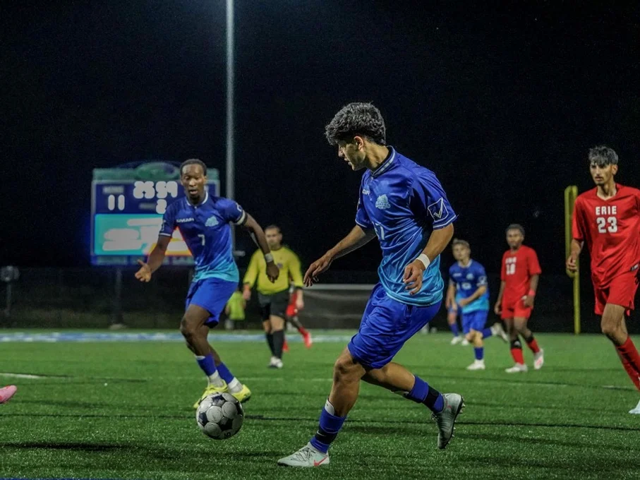 Two players from the FLCC men's soccer team on the field