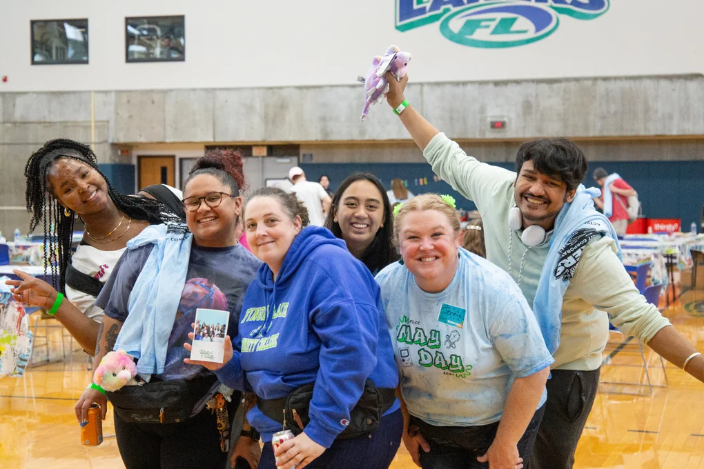 FLCC students and staff posing for a photo at a May Day event.