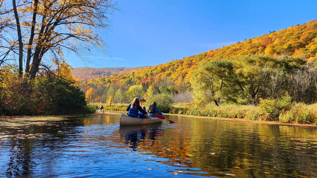FLCC students canoeing in Honeoye Lake on a beautiful autumn day.