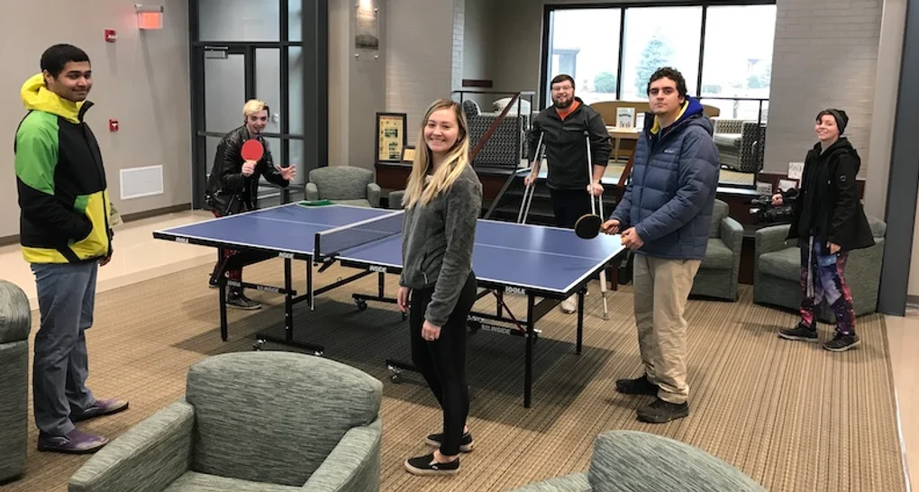 Students around a ping pong table