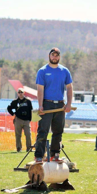 Lumberjack in t shirt holding an ax