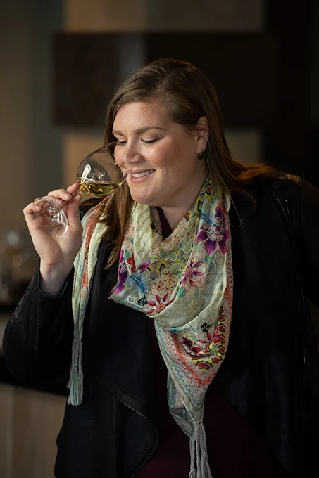 Elizabeth Keyser raising a glass of wine