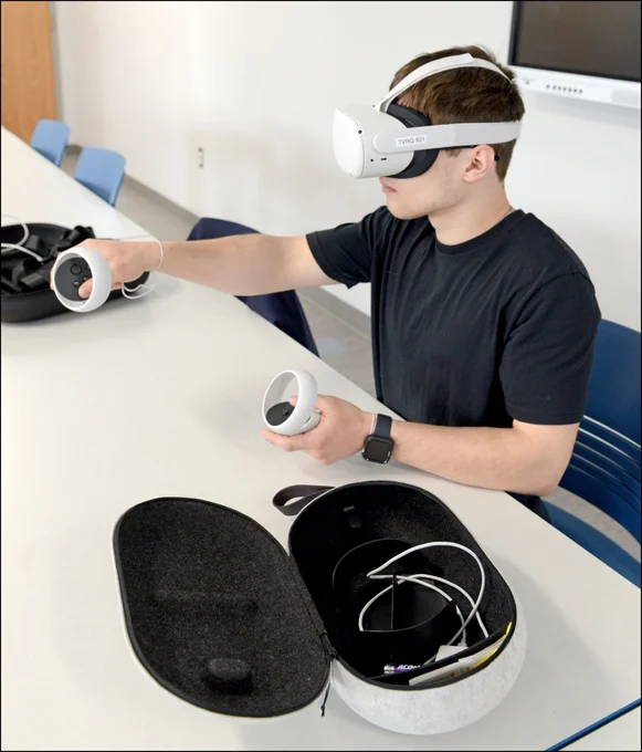 Man with VR headset and hand tools