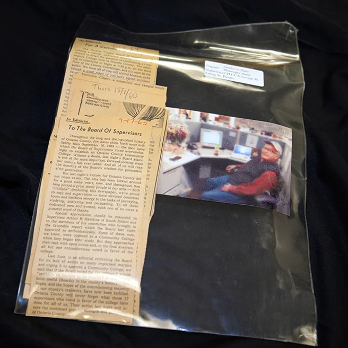 Newspaper clippings and older man