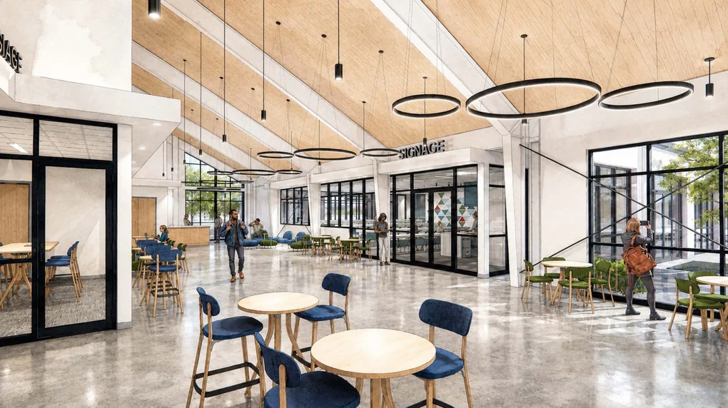 Artists rendering of a brightly-lit lobby with high wood ceilings, tall windows and some tables and chairs