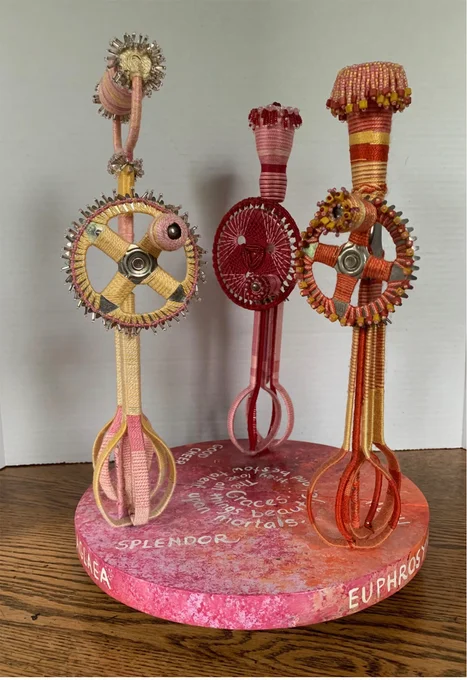 Three tall sculptures representing people