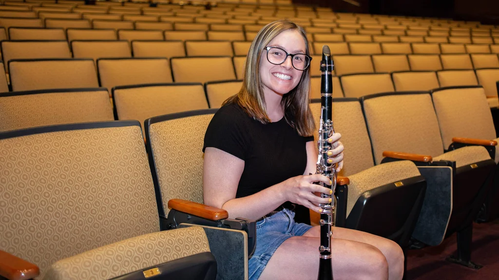 Music student performs clarinet in the FLCC Auditorium.