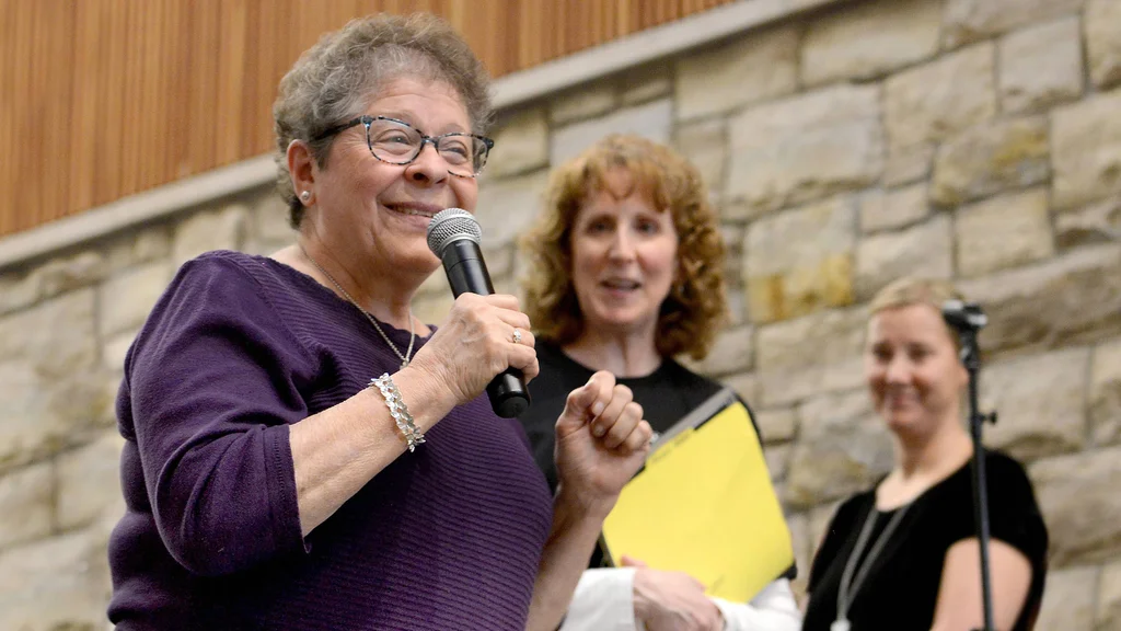FLCC employee speaking at an event, engaging the audience with expertise and enthusiasm.