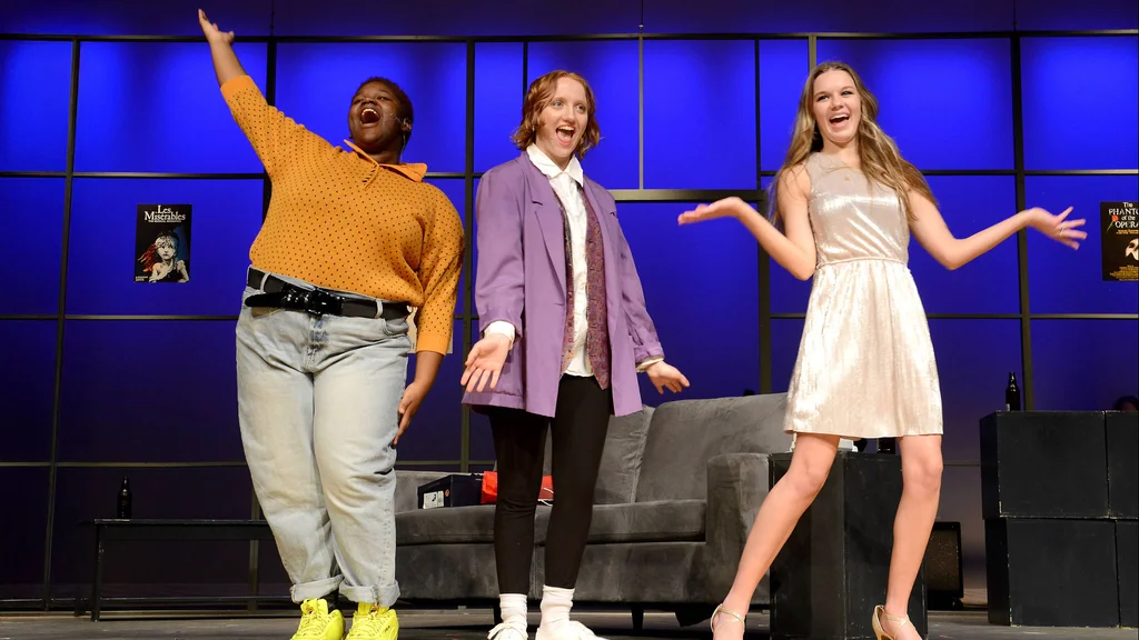 FLCC students on stage in the middle of a live theatrical performance.