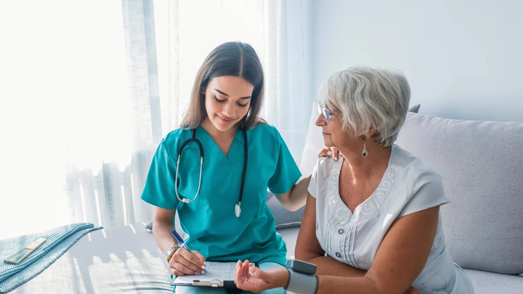 A healthcare professional supporting a patient.