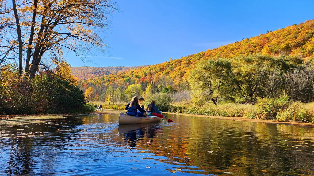 FLCC students canoeing in Honeoye Lake on a beautiful autumn day.