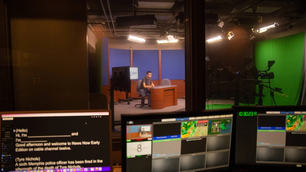 Communications students working with digital video production software.