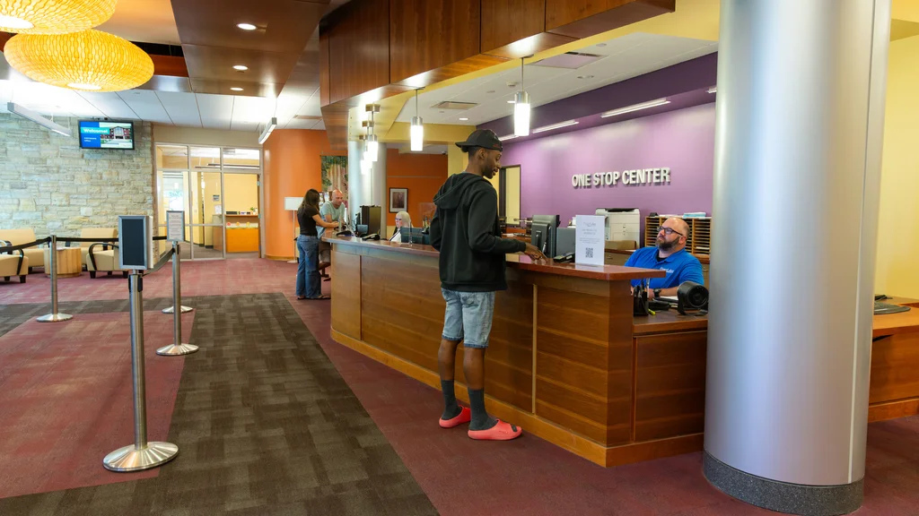 One Stop Center staff assist students with registration activities.