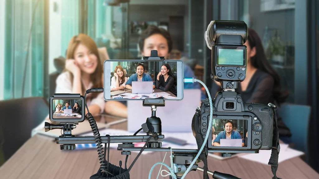 Multiple devices being used to record an event.