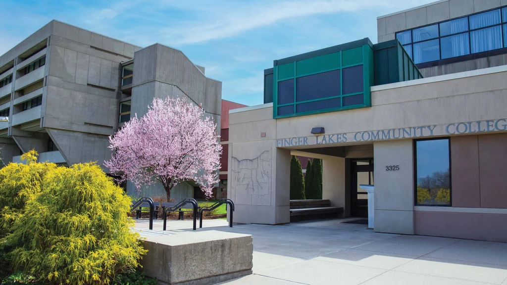 FLCC campus in the spring with flowering trees and shrubs.