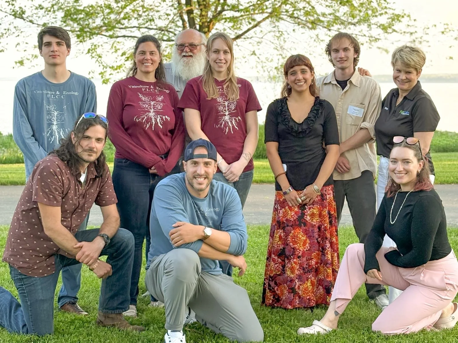 A posed group of individuals for a team photo at the FLCC Viticulture and Wine Center.