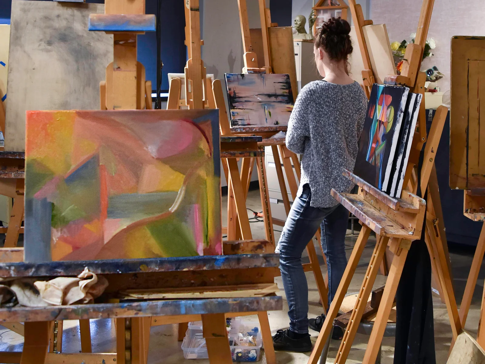 Student artist at work in the painting studio.