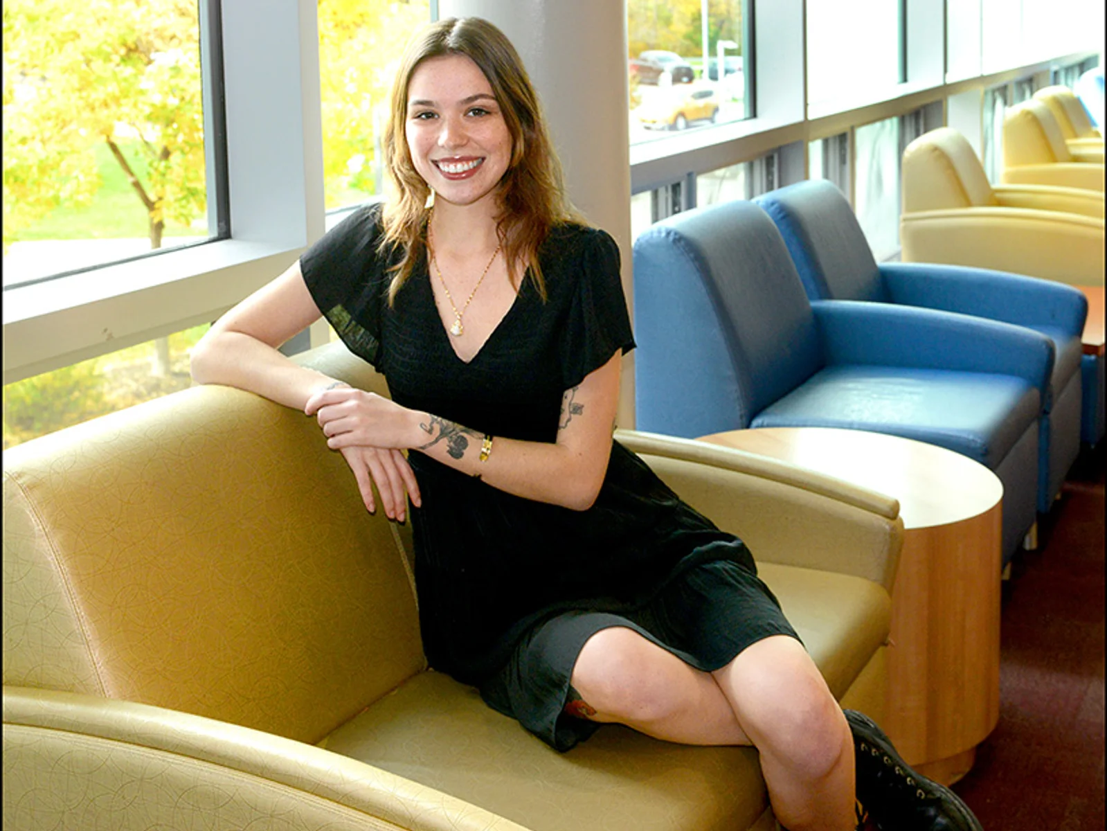 Lauren Smith seating on a chair in the student lounge