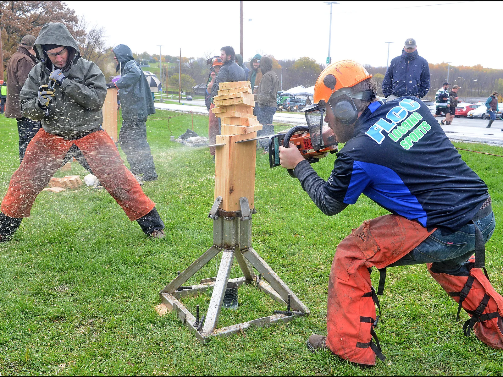 logging sports team member chainsawing log