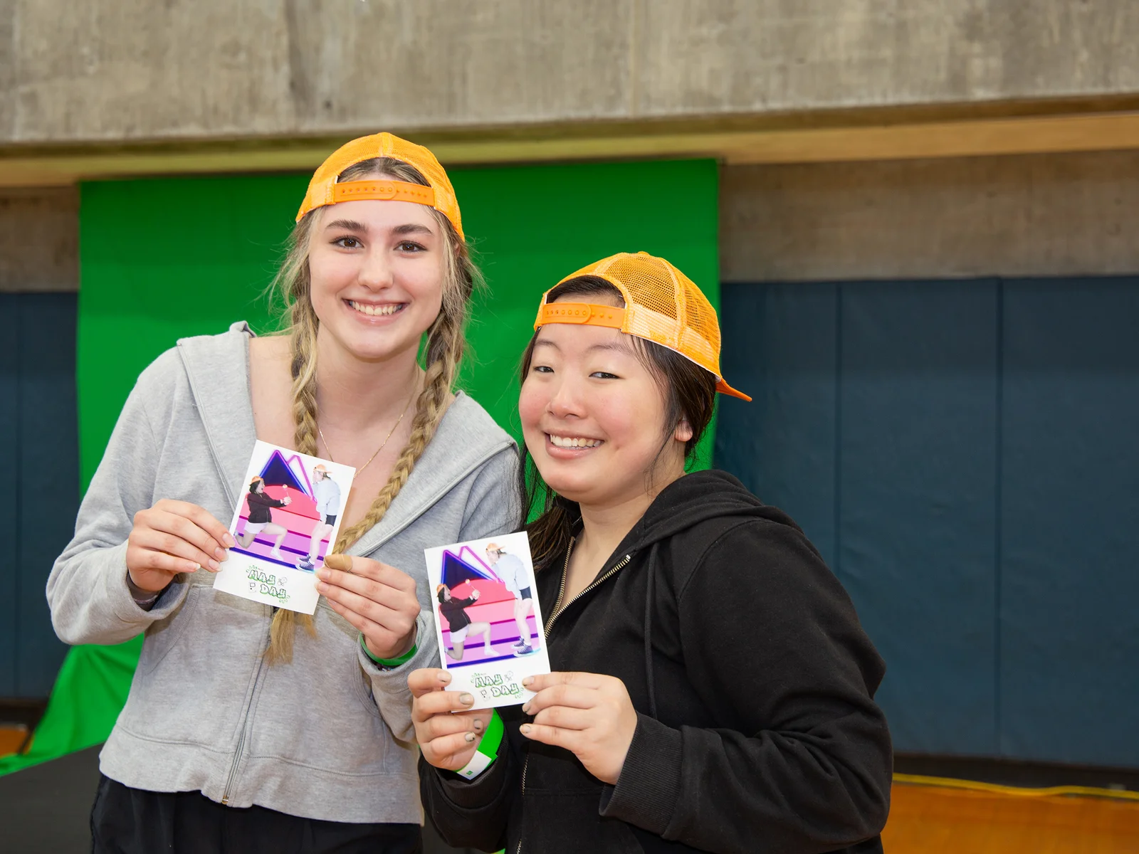 Two students enjoy May Day in the FLCC gymnasium