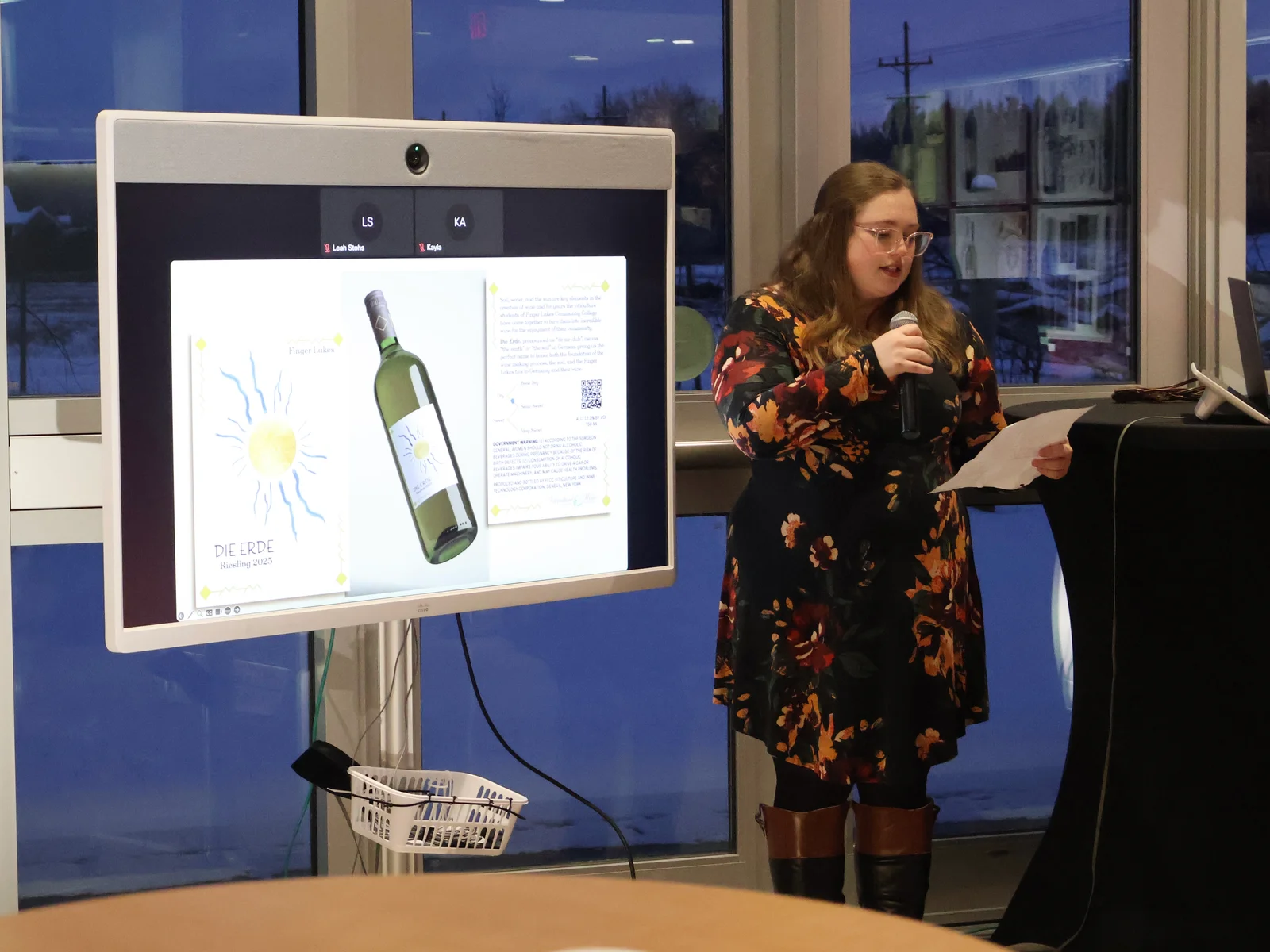 Lauren Turner presenting her design at the fall 2025 FLCC wine label design competition.