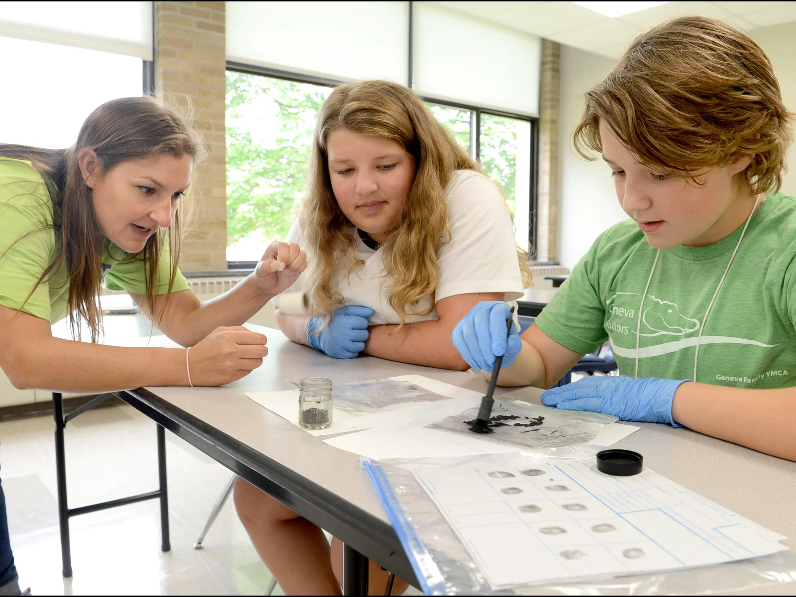 Instructor working with two middle school girls 