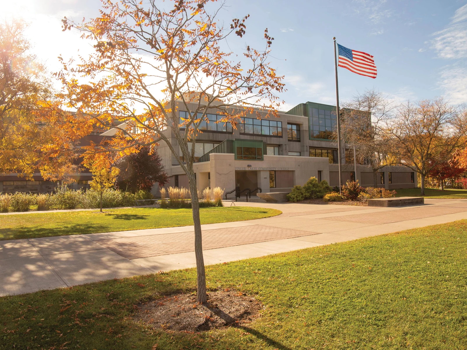 FLCC campus in the fall with orange, yellow, and red leaves on the trees.
