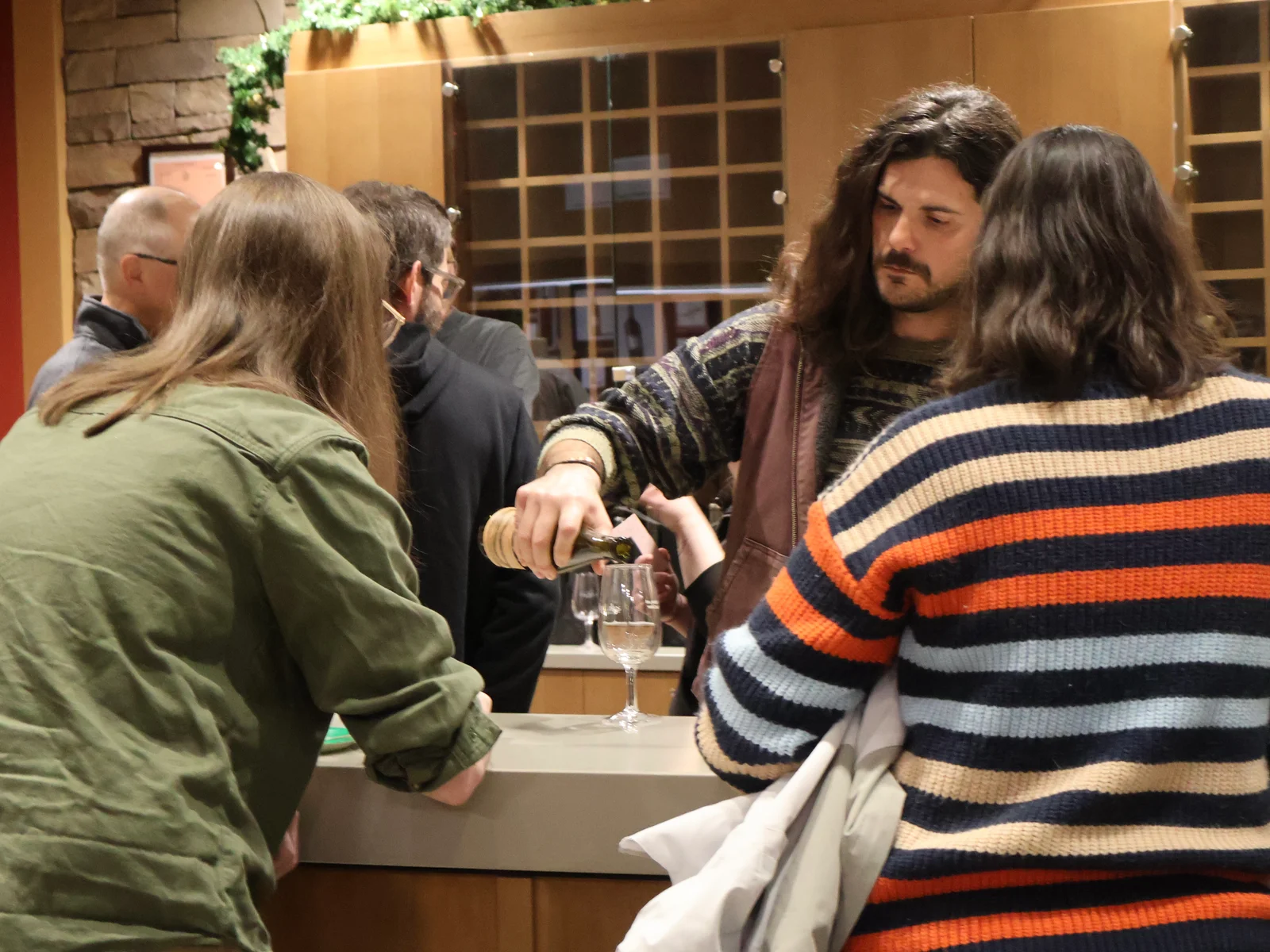 Lauren Turner presenting her design at the fall 2025 FLCC wine label design competition.