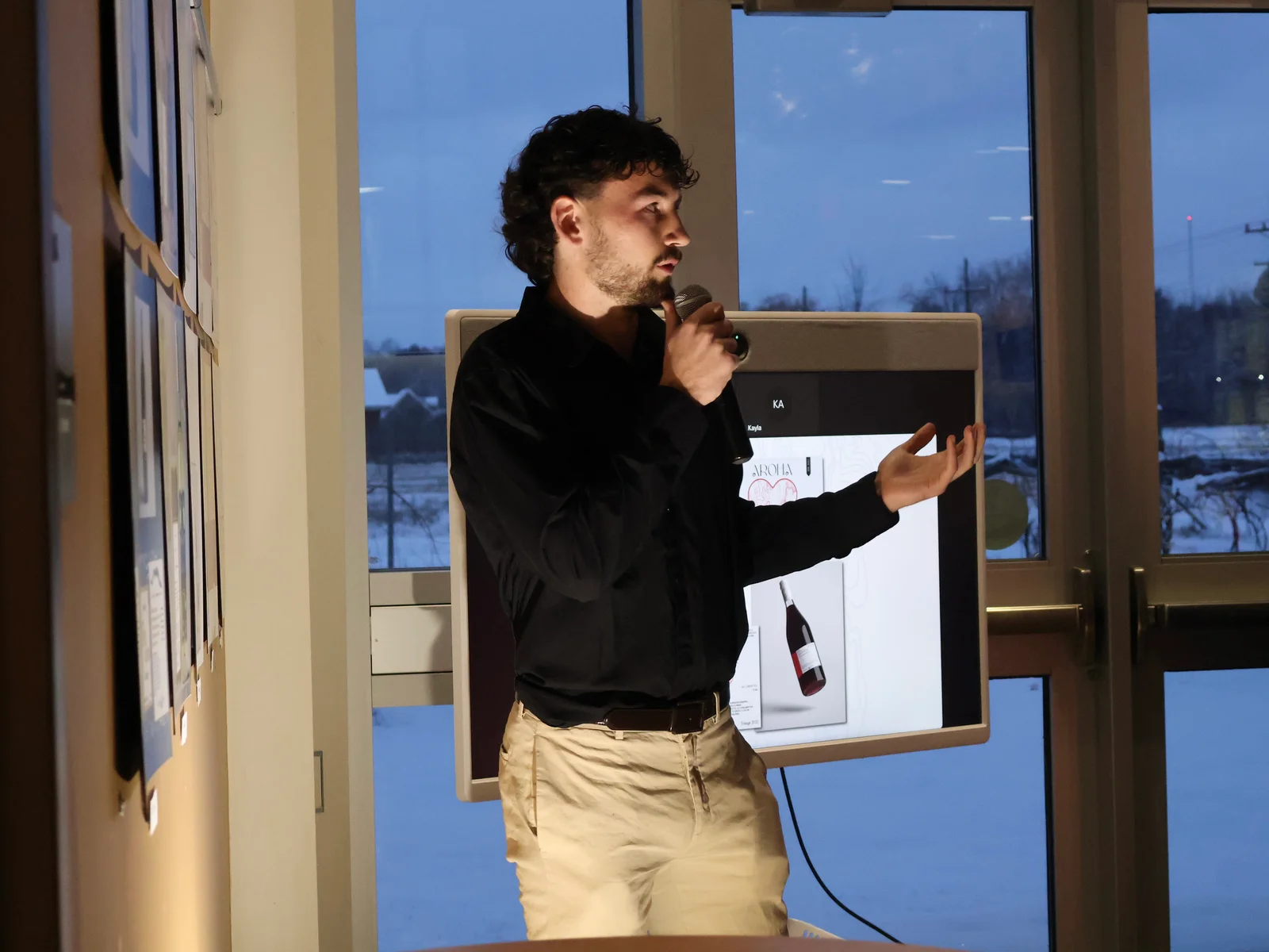 Lauren Turner presenting her design at the fall 2025 FLCC wine label design competition.