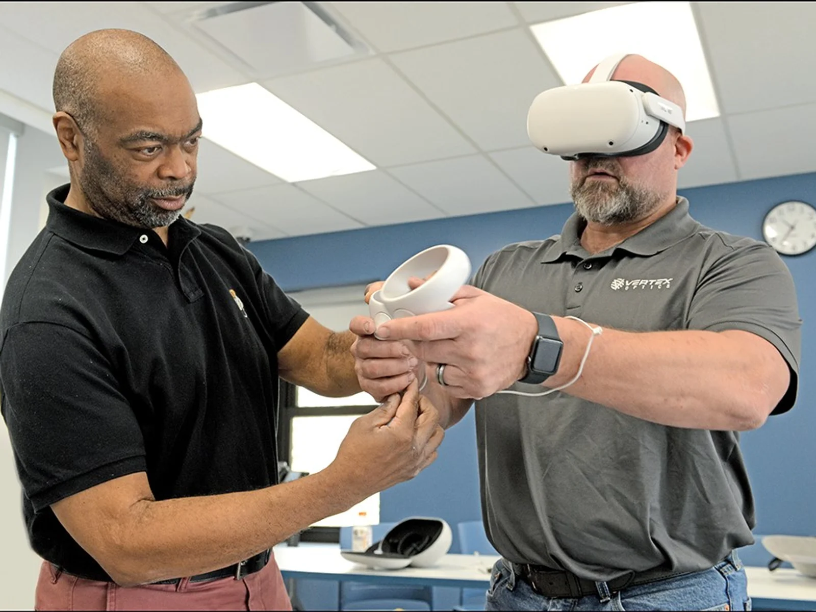 Instructor with student using virtual reality headset 