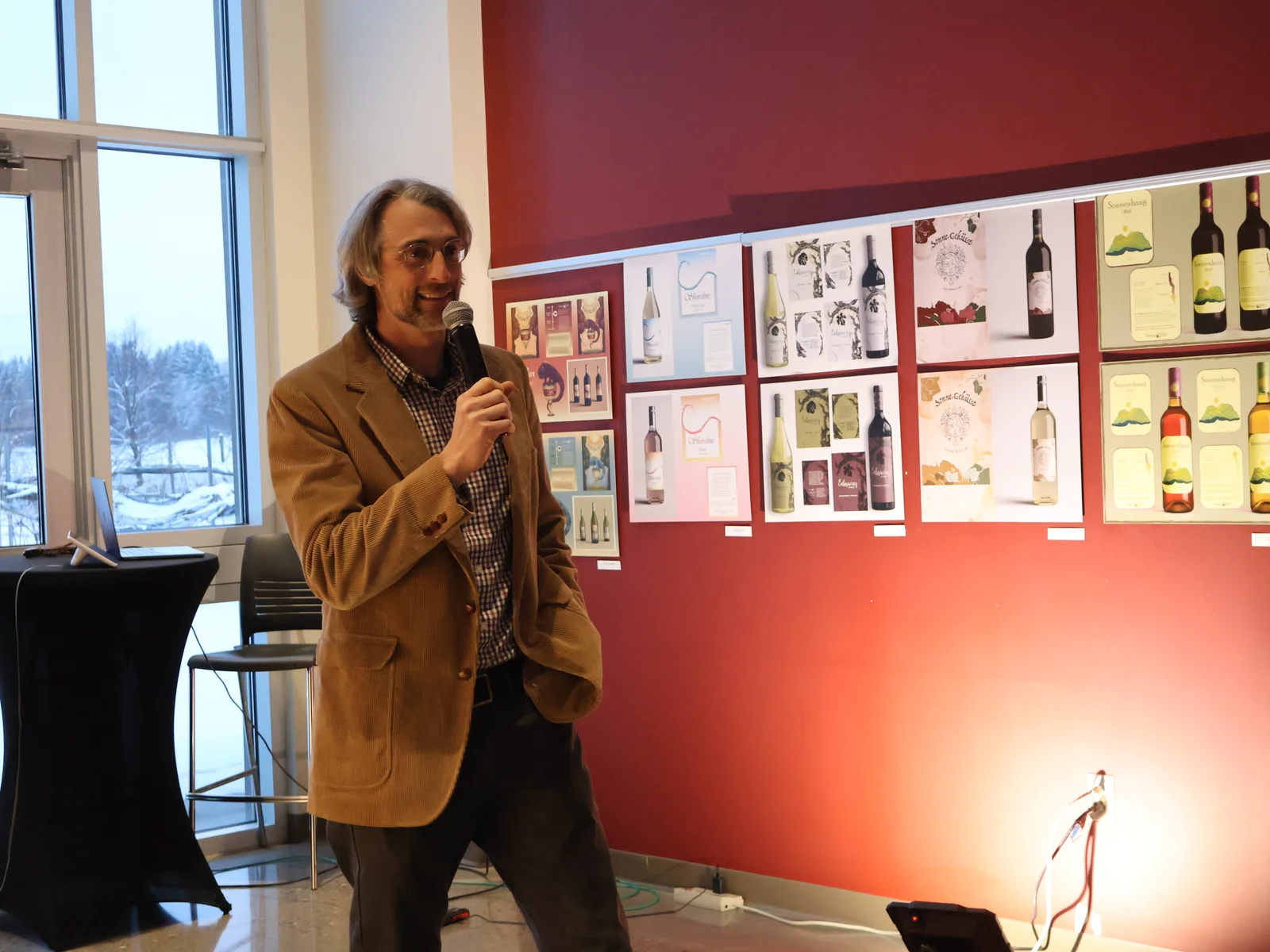 Lauren Turner presenting her design at the fall 2025 FLCC wine label design competition.