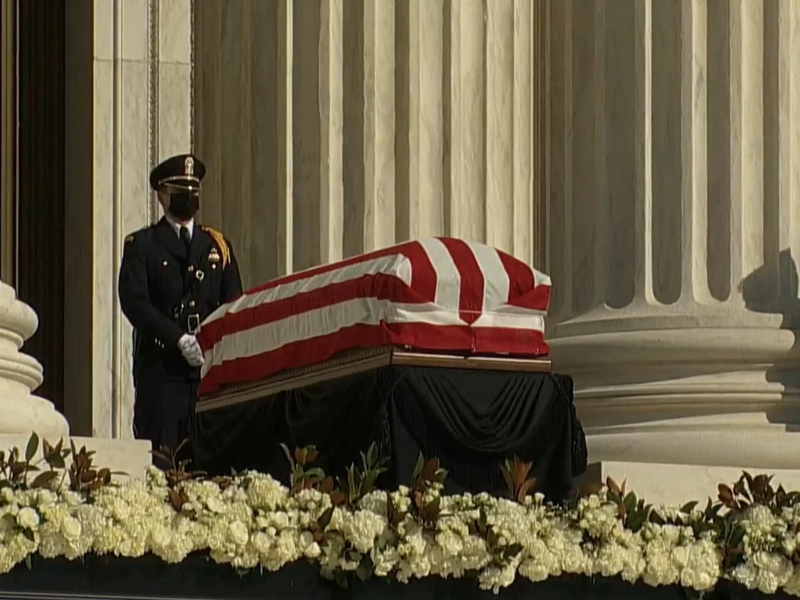 Three officers near the casket of Ruth Bader Ginsburg