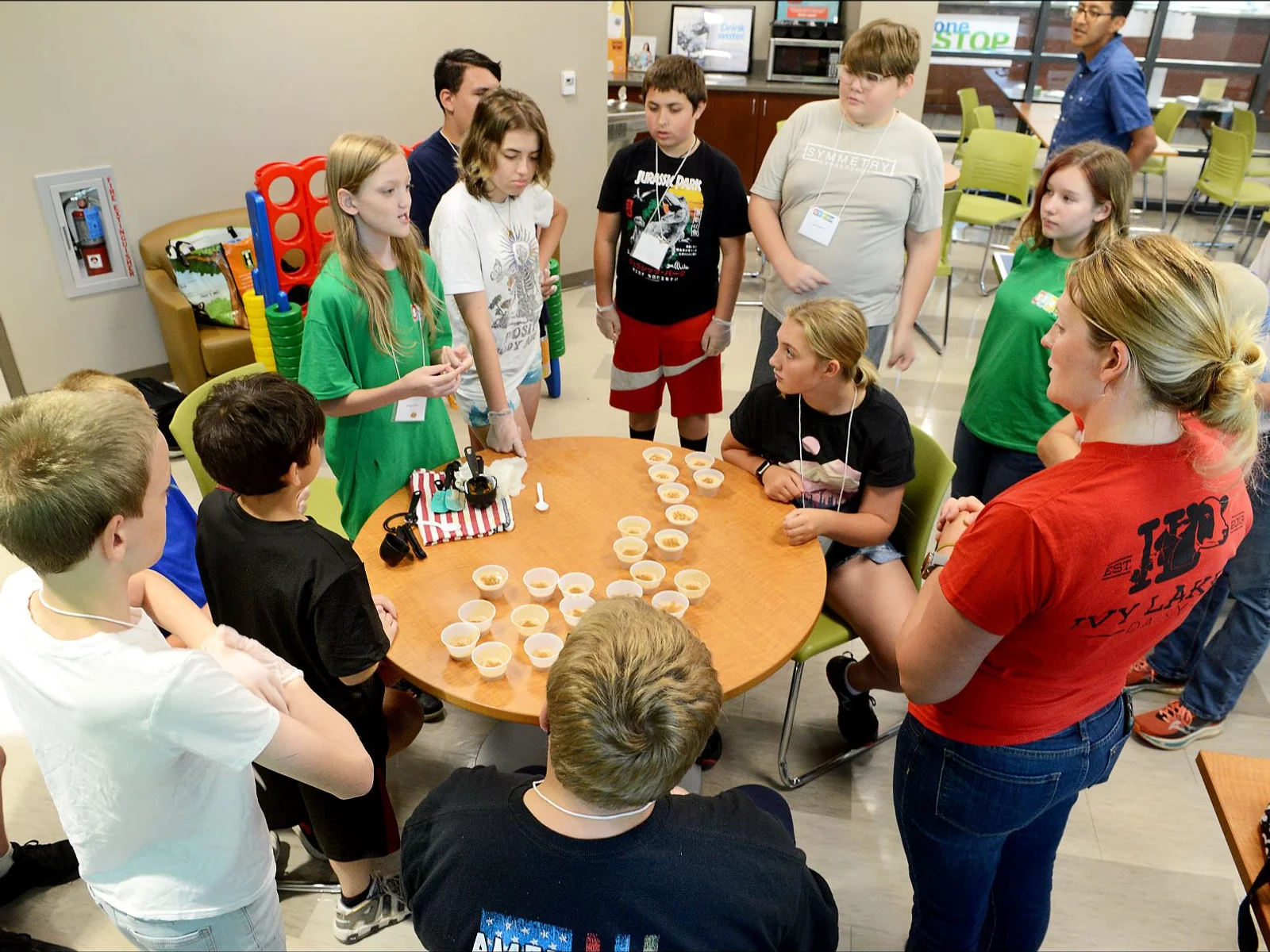 Instructor and students gathered around a table