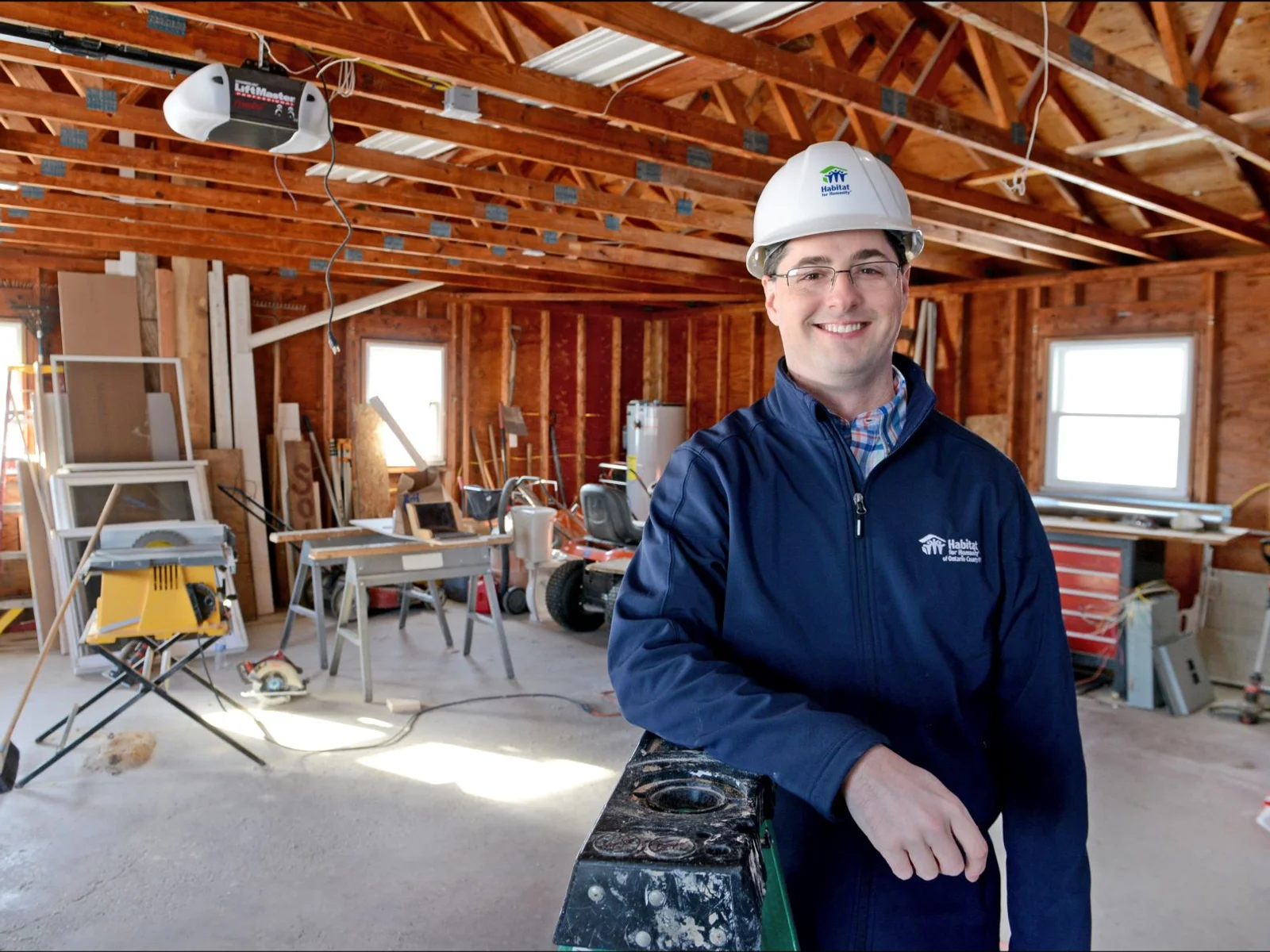 Man in hard hat at indoor worksite