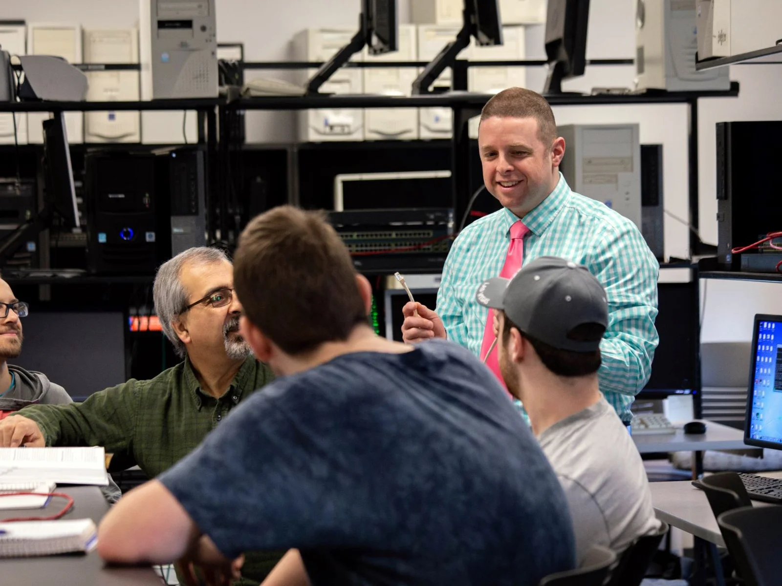 Professor in networking class with students