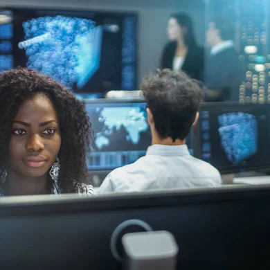 Students working at computer workstations.