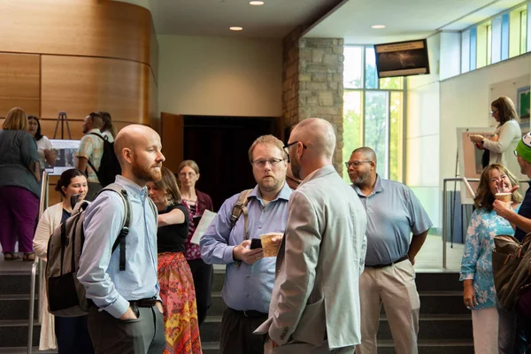 FLCC colleagues engage in conversation following the keynote remarks at Opening Days.