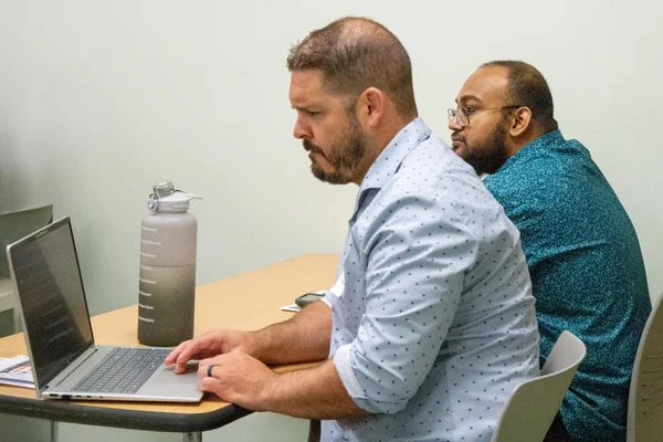 Workshop attendees put AI training to use in a hands-on session.