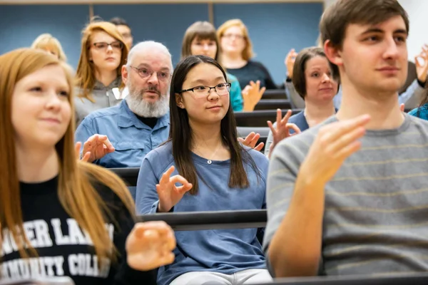 FLCC students practicing American Sign Language together in a class.