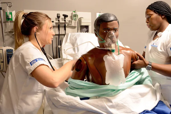 Nursing students practicing medical treatment in the Sands Family Center for Allied Health at FLCC.