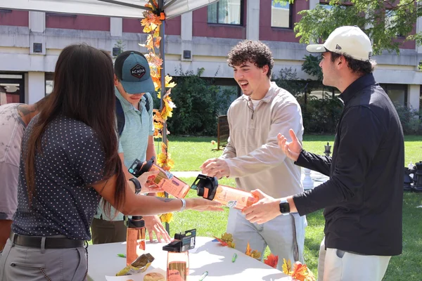 Students getting free water bottles at Fall Fest.