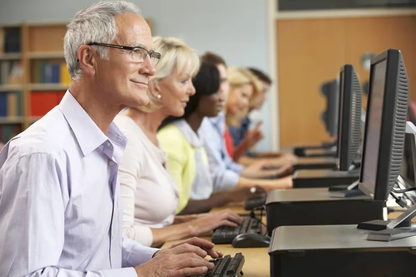 Students conducting research on library computers.