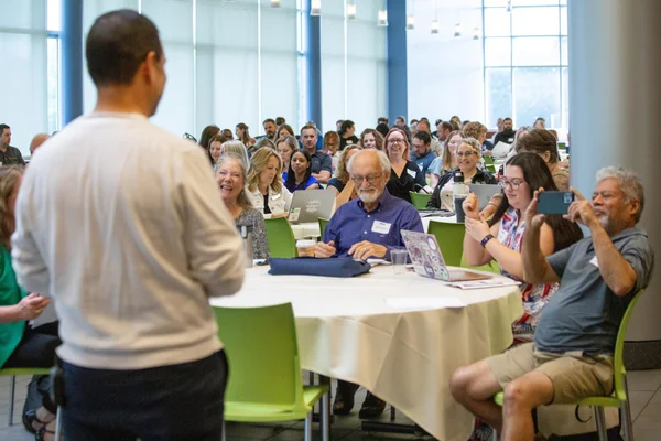 Attendees celebrate newfound knowledge in Artificial Intelligence at the AI Conference.