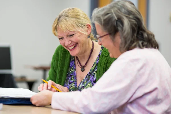 An FLCC student working with a tutor on a course assignment.