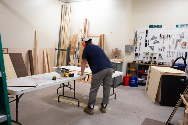 Student works on constructing a theatre set for an FLCC performance.