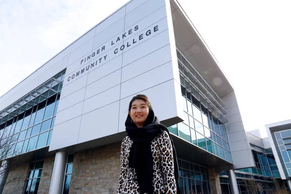 FLCC student near the main building on the Canandaigua campus.